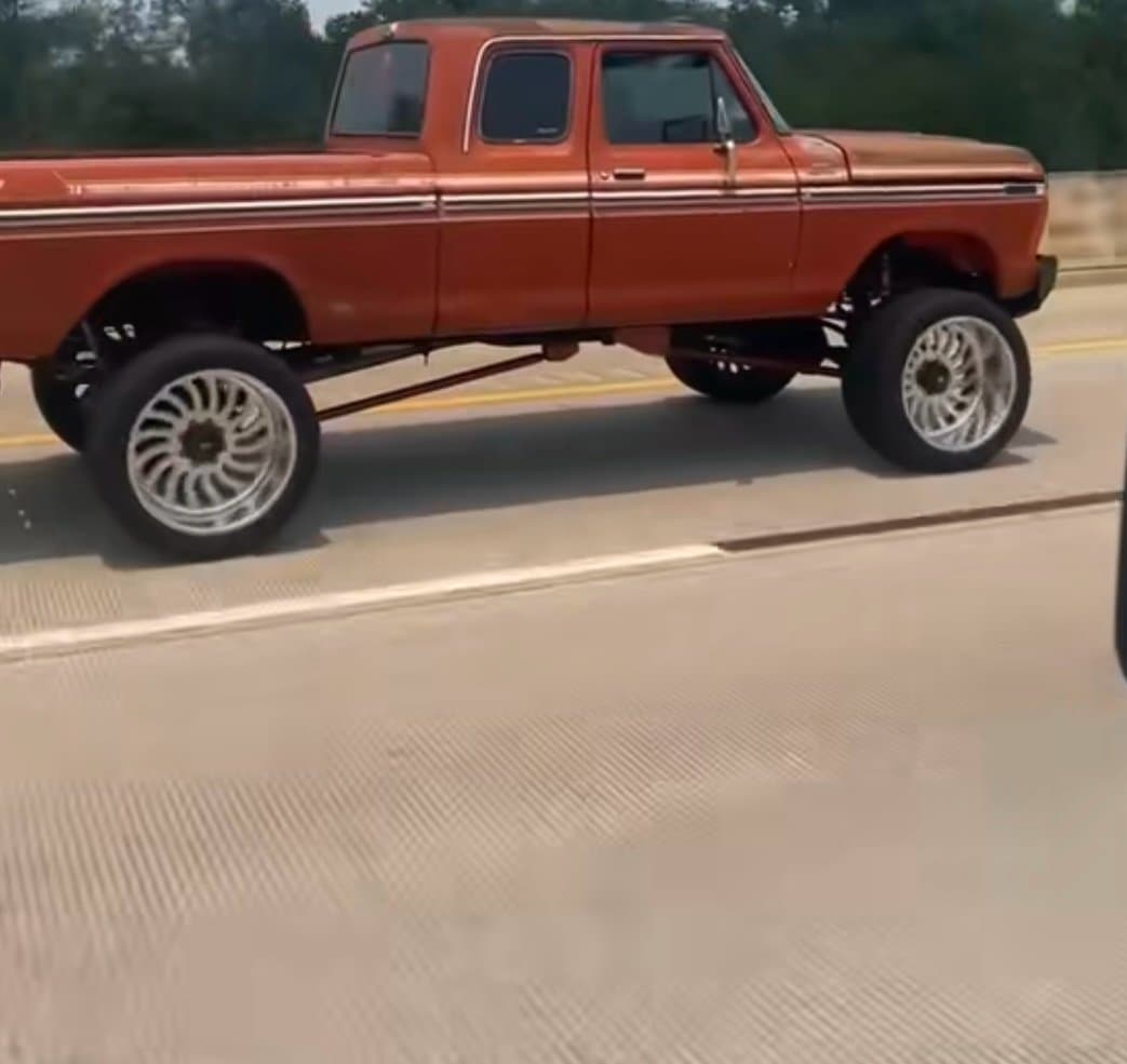 Classic lifted Ford truck built on a custom suspension setup by 2 Man Fab