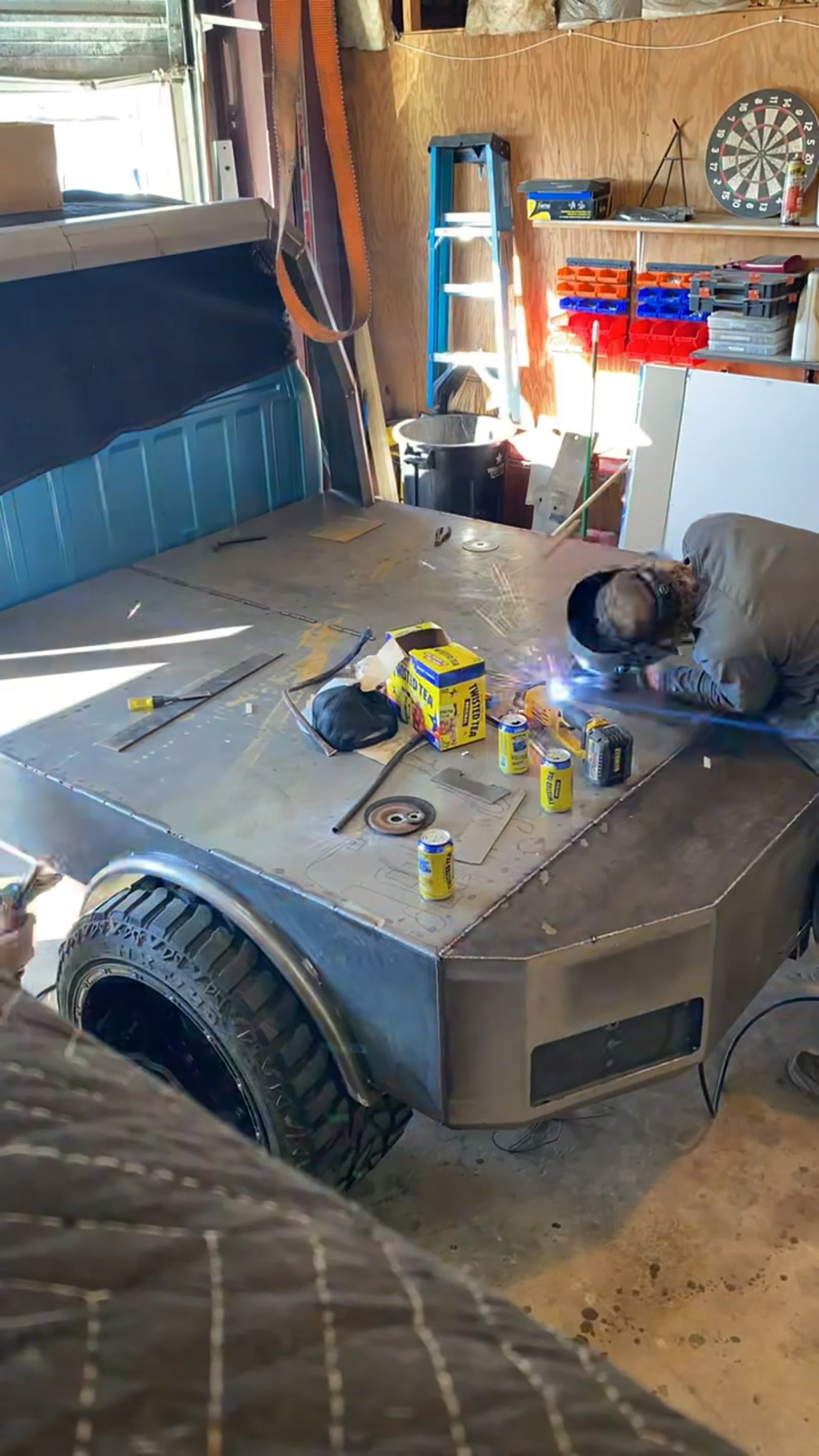 Close-up of a 2 Man Fab welder TIG welding a custom steel flatbed panel