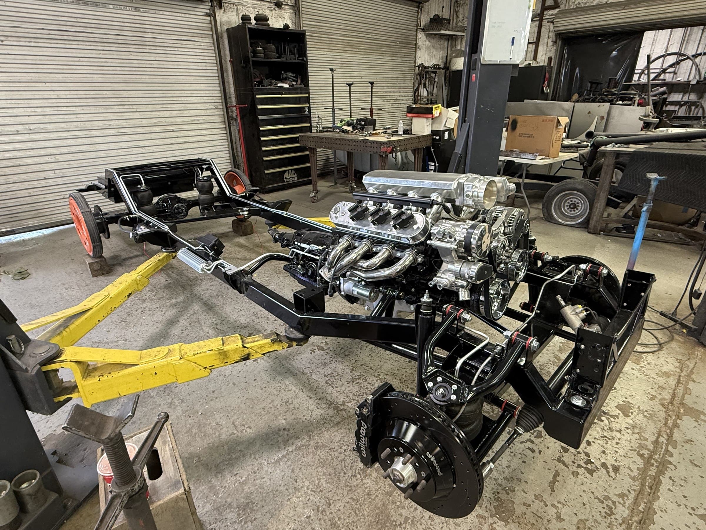 Custom tube chassis with a supercharged V8 and air suspension built by 2 Man Fab