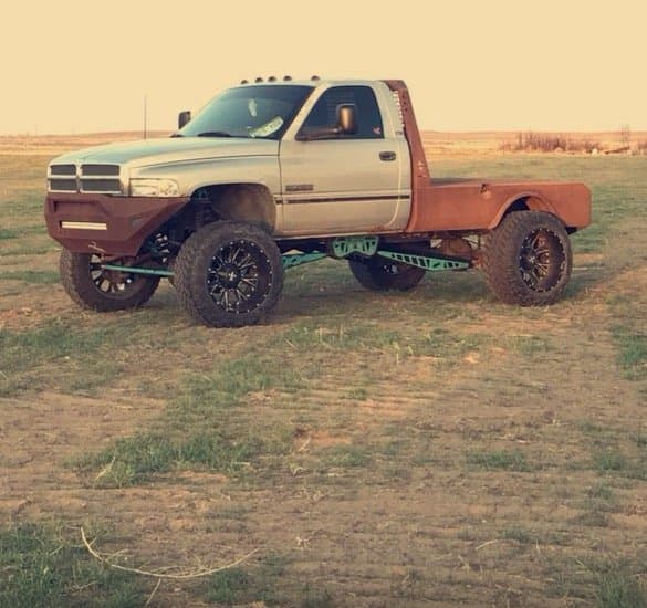 Lifted Dodge Ram truck with a custom front bumper fabricated by 2 Man Fab
