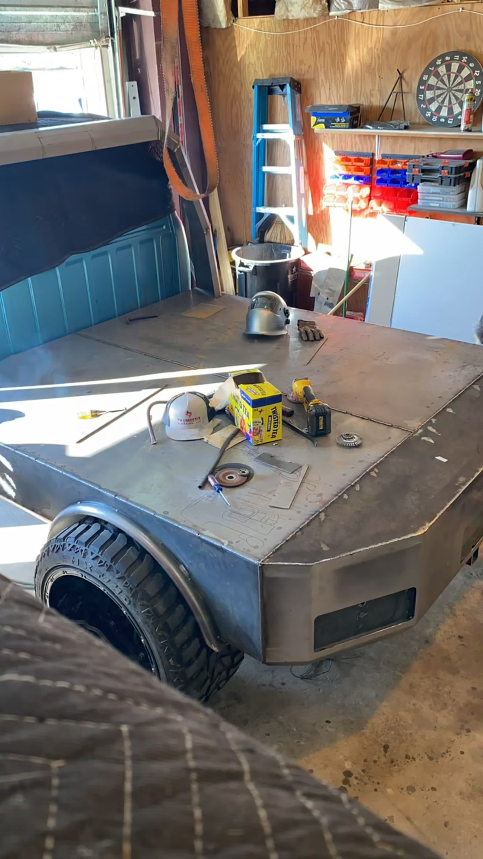 Inside the 2 Man Fab shop with a custom flatbed build in progress